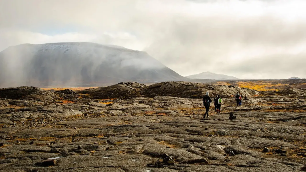 Researchers crossing a lava field in Iceland
