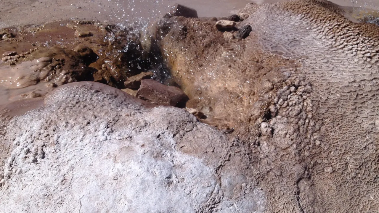 Silica sinter forming around an erupting geyser vent