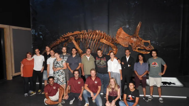 The Dinolab team posing by the first skeleton they finished: Triceratops Dirk