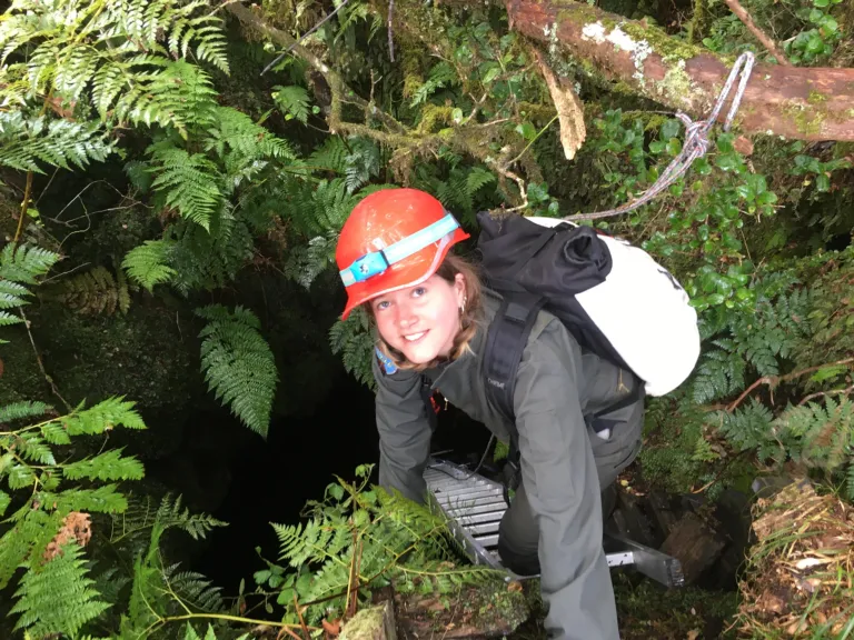 Nina Kopacz descending into a lava tube in the Azores.